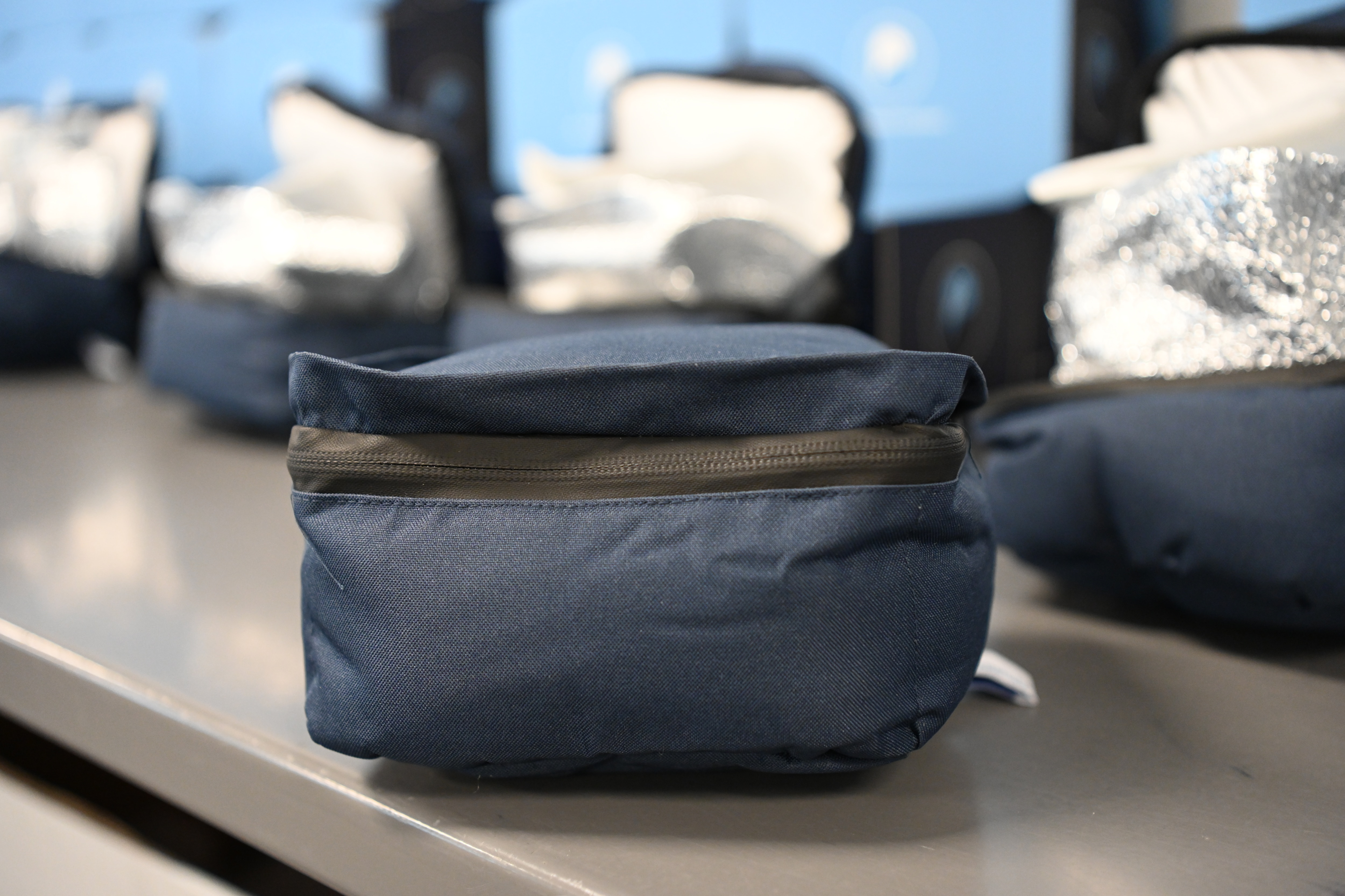 Closed cotton-based insulated package with zipper, designed for product shipping.