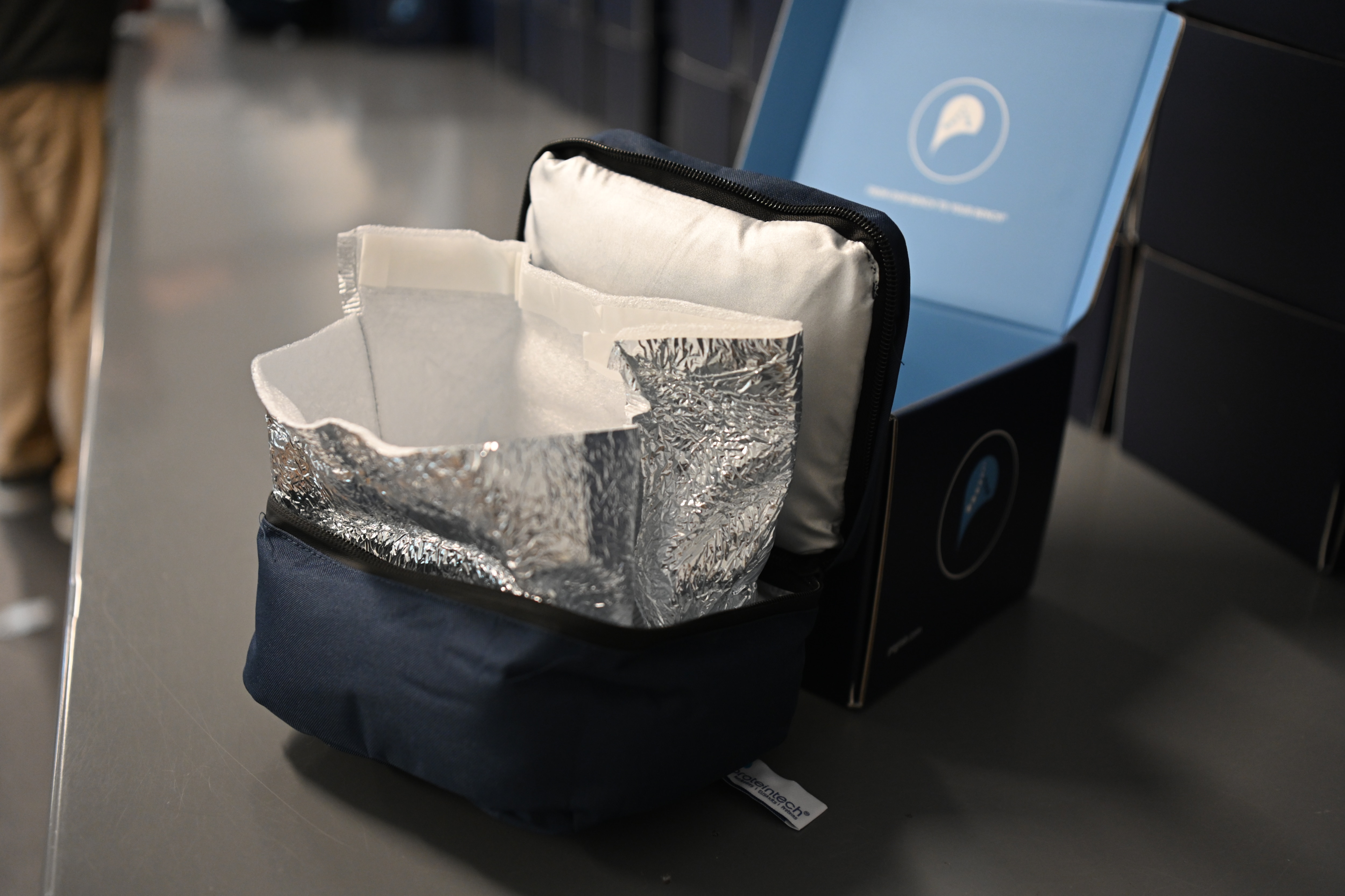 Open view of cotton-based insulated packaging, showing the inner lining and protective padding.
